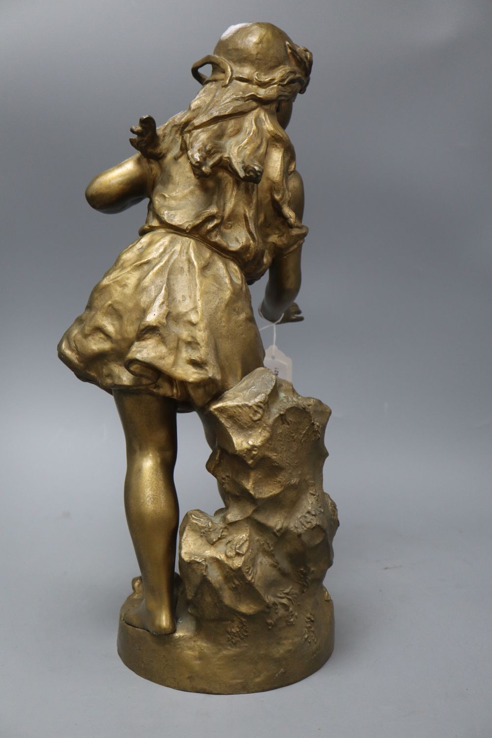 An early 20th century gold painted bronze model of a girl, height 50cm